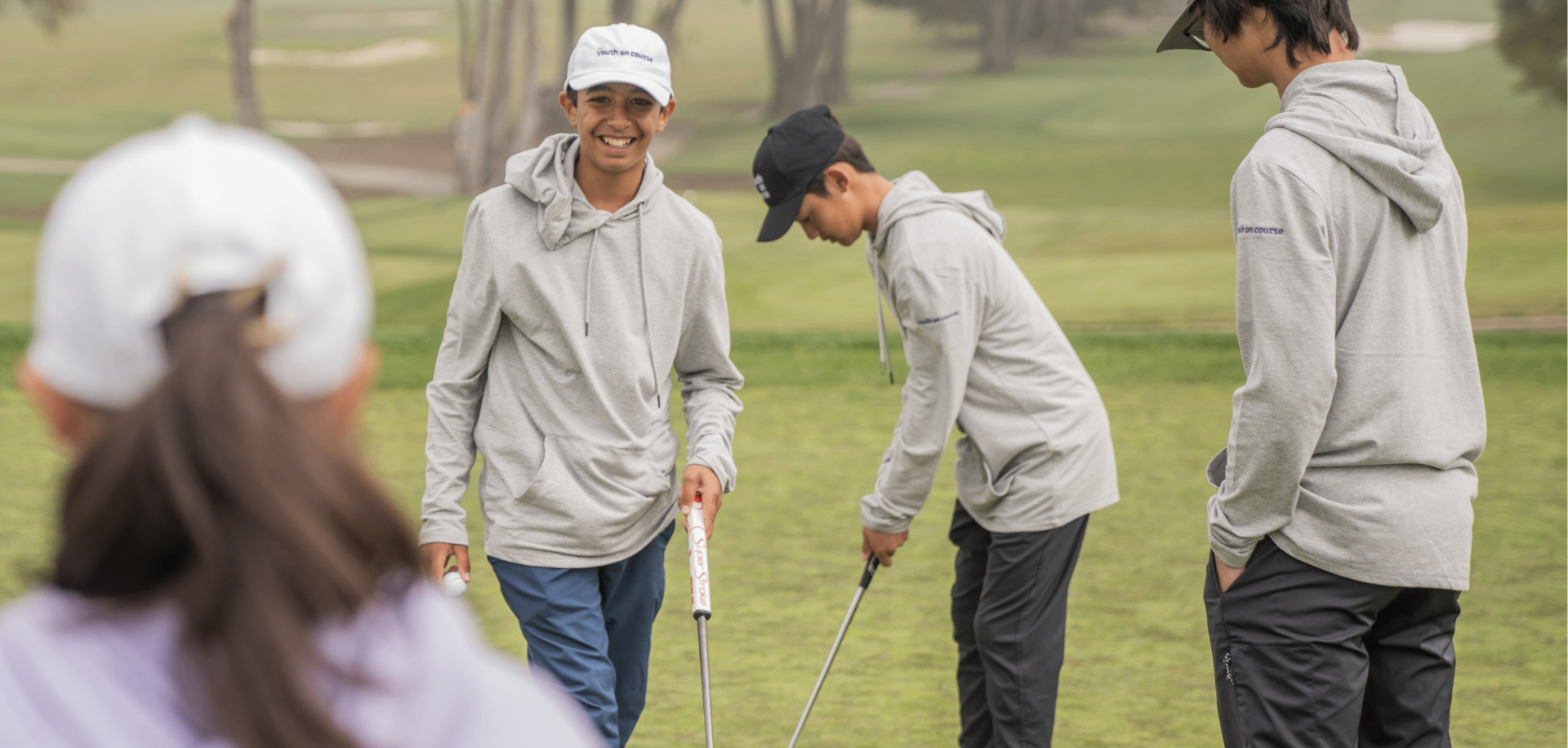Student volunteers on a golf course
